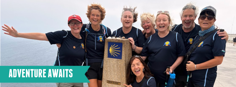 A group of Adventure Geek pilgrims at the zero-mile marker at Finisterre, also known as the end of the world